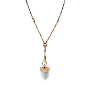 Necklace with a gold and silver pendant on a white background