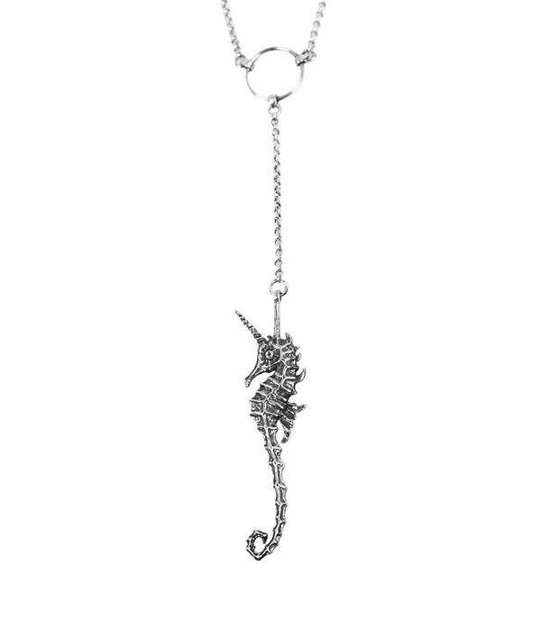 Silver seahorse necklace on a white background
